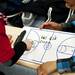 Kids write on a white board in the Milan locker room after the game on Monday, March 11. Daniel Brenner I AnnArbor.com